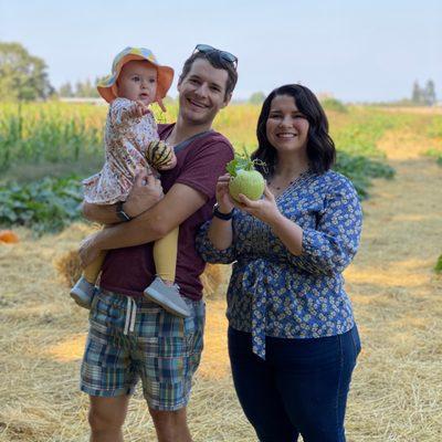 Daniel, owner and photographer of Aperture Impressions, with wife and child at pumpkin patch 2022.