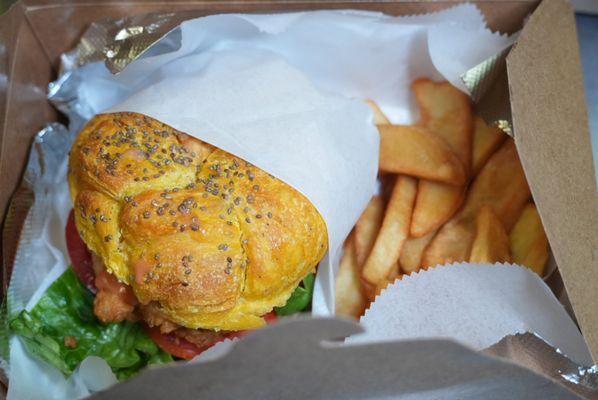 Our tasteful tumeric brioche whitening fish burger served with fries.