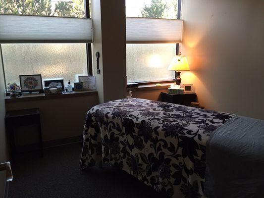 Cozy massage room set up for an individual session.