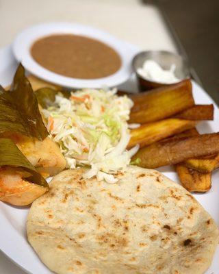 Our Gladis Super Special: One pupusa (your choice) fried plantain, refried beans, one tamale.