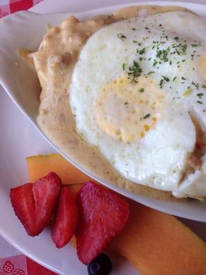 Biscuits and gravy with an egg on top