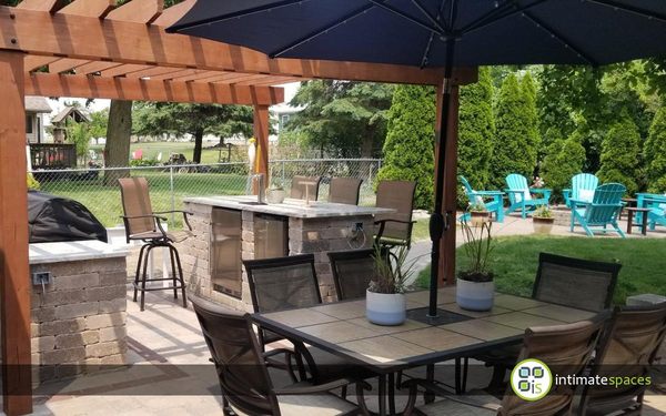 Paver Patio, Galley Outdoor Kitchen + Grilling Island + Bar with Kegerator & Fridge, Wood Pergola, & Fire Pit.