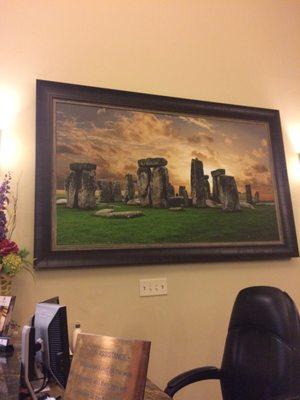 Painting of Stonehenge "the healing place" at reception desk.