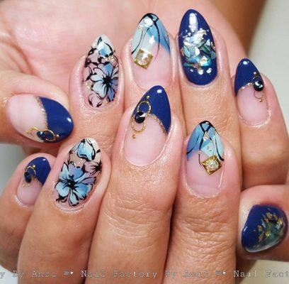 Floral navy blue french nails.