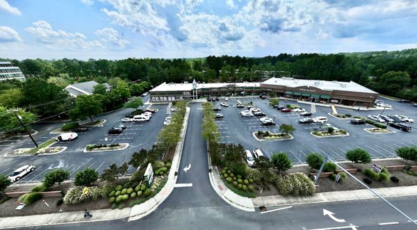 Overhead drone view of Glenwood Square shopping center by UNC Health. Photo taken from above highway 54 (Raleigh Rd).