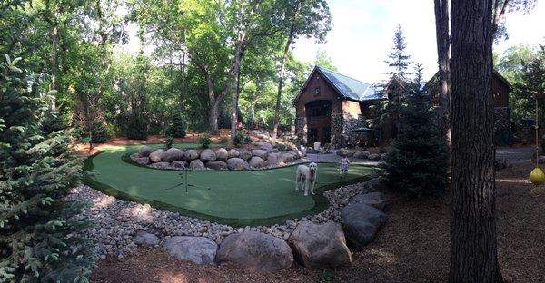 New back yard putting green, patio and retaining walls.