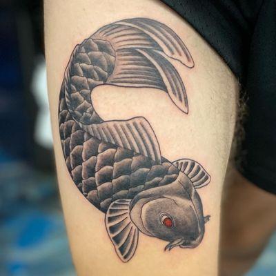 Koi fish , black and grey thigh tattoo.