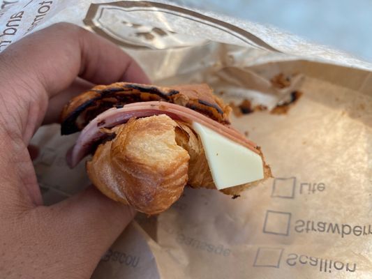 Ham, egg and cheese on a croissant toasted with butter. (FYI CT white American is default at most restaurants)