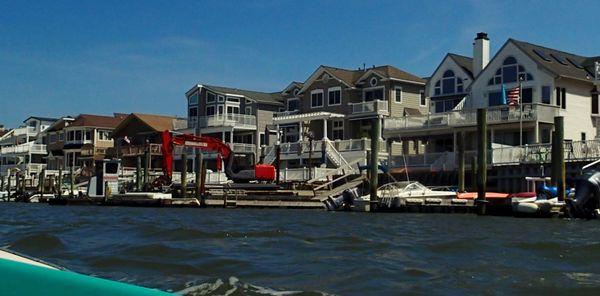 View of homes from a paddle board in the bay of Sea Isle City