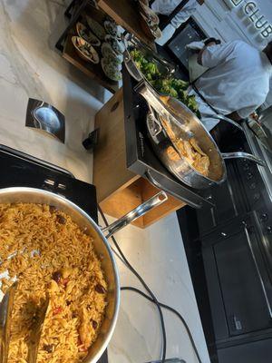 Olive Paella... weird combo and not that great. Behind there is baked fish and roasted broccoli, which were also not very memorable