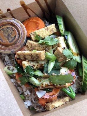 Vegetarian version of Khao Mun Gai: Stirred fried vegetables and fried tofu served with steamed rice and ginger-garlic sauce.