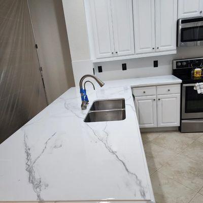 Cabinets and countertops after refinishing project.