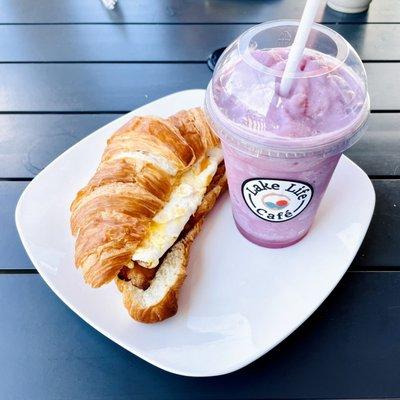 Croissant breakfast sandwich and mixed smoothie.