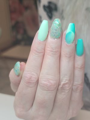 Green nails with a french illusion ombre accent nail.