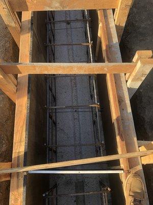 Nice and clean inside the form with rebar and snap ties to hold the concrete commercial slab