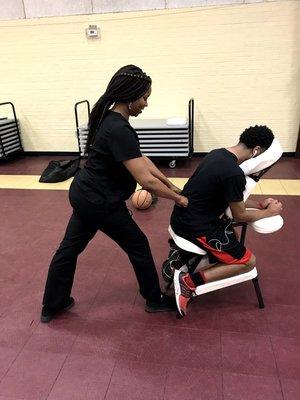 Giving back to the local community by providing chair massages for the patrons at Greenview park in Columbia,SC.