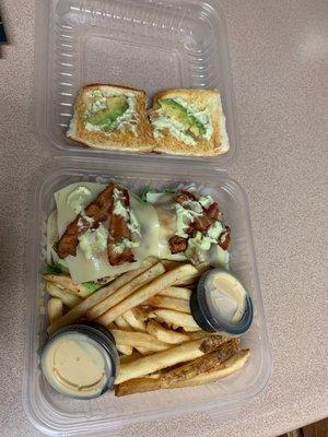 Chicken bacon avocado sandwich with frozen fries. The cooks bacon is cold, the cheese is slightly melted but cold, and the avocado is sad.