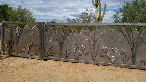 Custom design gate and fence at horse ranch