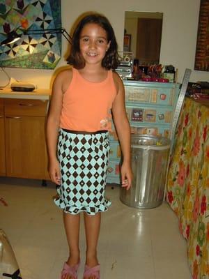 Isabella in skirt she designed and sewed.