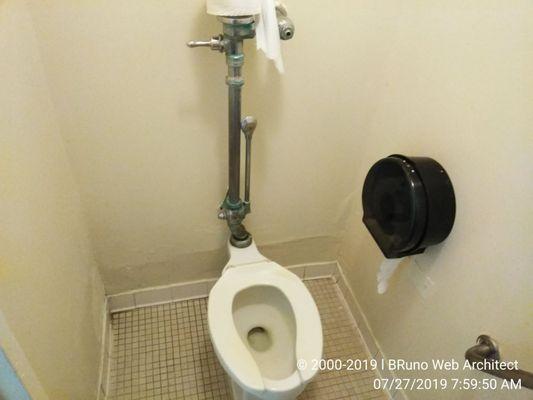 Defective, spotted and dirty toilet.