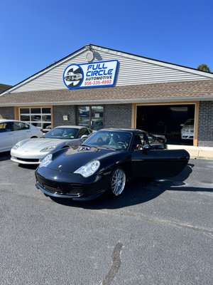 Porsche 911 Turbo in for repairs service, tire mount and balance, hand car wash, paint correction, detailing and ceramic coating services.