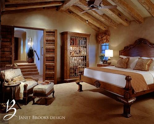 This sexy bedroom uses reclaimed beams overhead, a repurposed old door and warm plaster walls to create an intimate retreat.