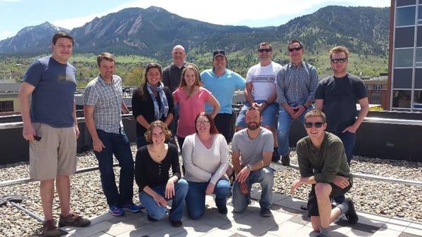 Our Boulder team taking in some sun on our rooftop patio.