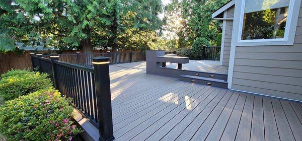 793 square feet of Wolf brand PVC decking with Timbertech "Radiance Rail" plus post cap lights and stair riser lights.