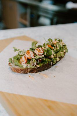 Avocado Toast topped with house made chipotle drizzle