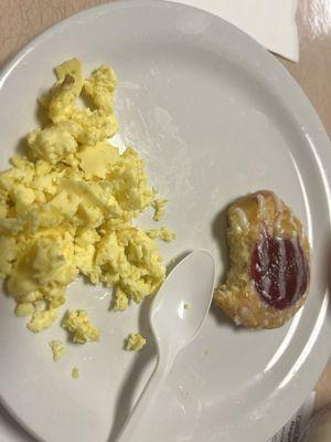 Another breakfast scrambled eggs with cheese danish. Only a plastic spoon to eat with.