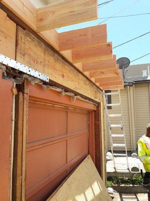 Removed & rebuilt entire front section garage and installed new railing and decking.