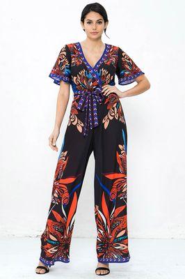 A printed jumpsuit featuring surplice neckline, fluttered sleeves, elasticized waist with self-sash tie and wide leg