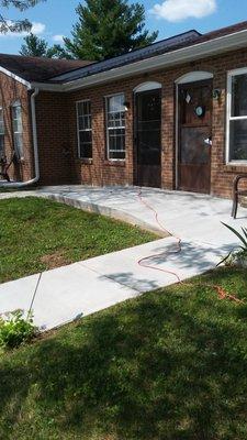 Picture of the front of our apartments. All are garden style with their own front porch and patio area.