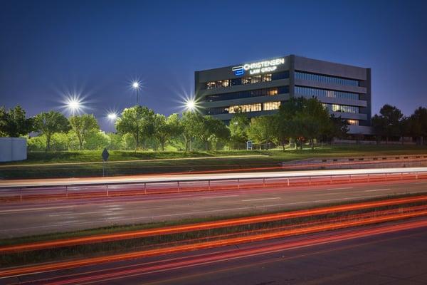 Night shot of the Christensen Law Group office building from Hefner Parkway.