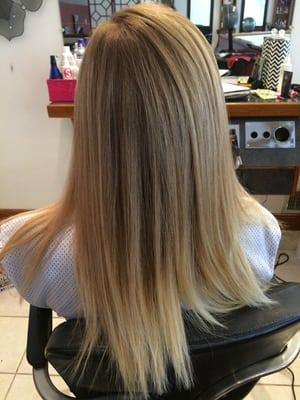 Blonde balayage with brighter ends.