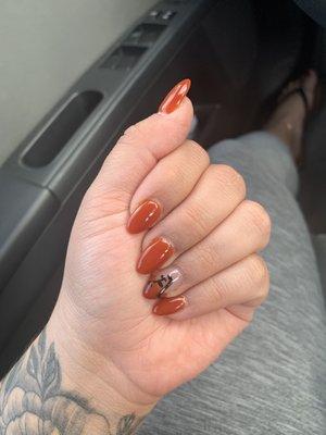 Almond nails with old English lettering on left hand