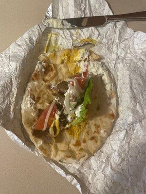 This is what a Mexican gyro looks like...    Maybe 3 small pieces of gyro meet....   But not like you can eat it smothered in mustard