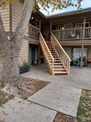 Stairway replacement at apartment building. Made of solid wood.