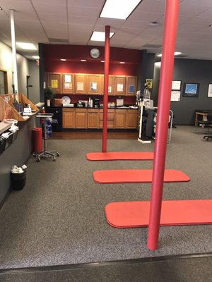 Stretching area and kitchen with coffee and granola bars