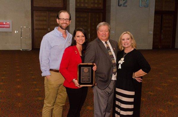 Dr. Ketron won the 2018 New Dentist Leadership Award by the Texas Dental Association.  The photo is of her husband and family.