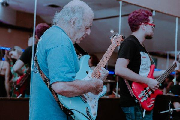 Guitarist soloing at concert for Double Bar Music Adult Rock showcase