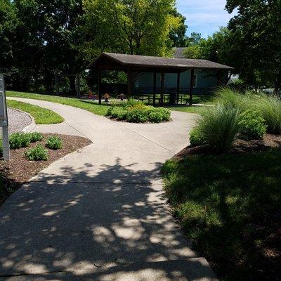 nice landscaping and paved pathways through the park