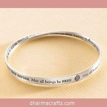 Metta Bracelet, sterling silver: A never-ending Metta Prayer entwines this finely engraved Möbius form bracelet. Metta means lovingkindness.