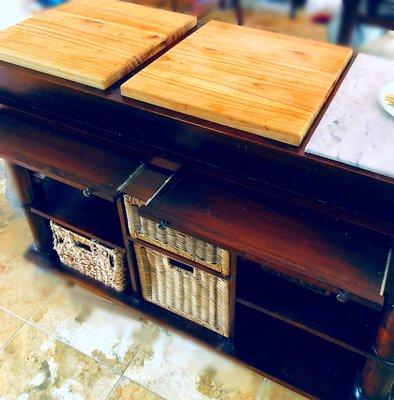 Kitchen Island with two (partially) extended tables and three utensil drawers (underneath them).