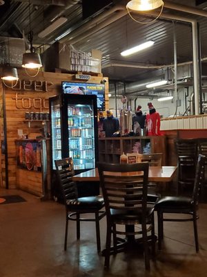 View from our table of front counter and cooler with Benny's Specialty Brews.  6/3/2023