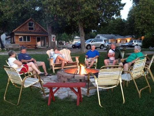 Evening get-together at the fire pit located on the Norrland Common Area where guests can picnic at tables or take in the view.