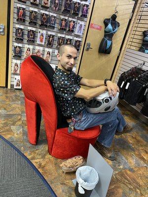 My hottie hubbie on the amazing plush high heel shoe chair.