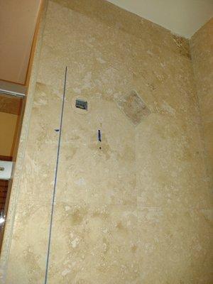 Prepare to mount the bracket for the shower system