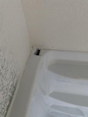 Gaping hole in the shower.