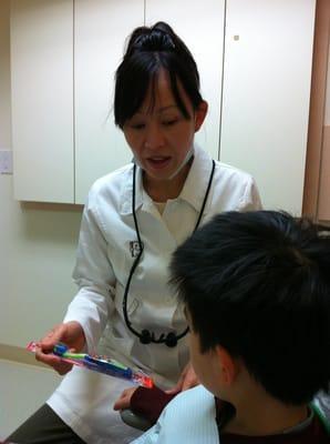 Dr. Truong instructing young patient